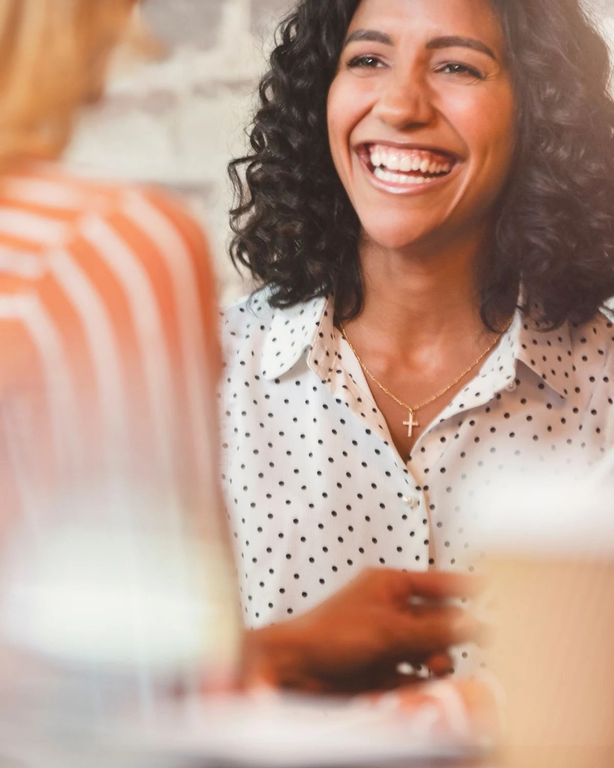 business-coaching-services A professional woman discussing positive next steps with her business coach